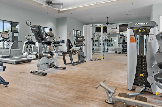 exercise room with a ceiling fan, recessed lighting, and wood finished floors