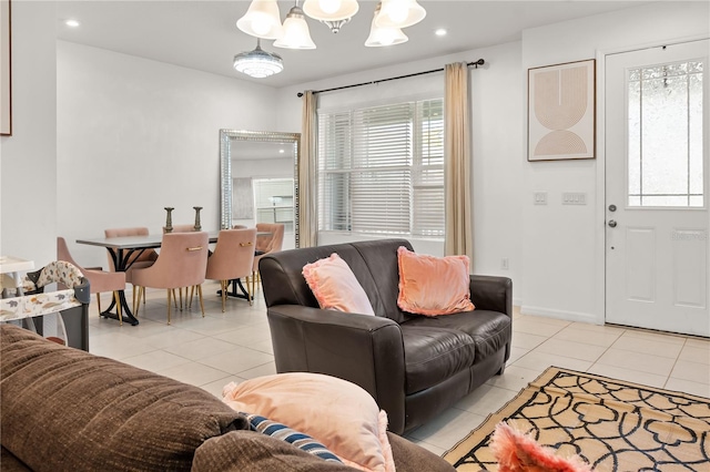 living room featuring light tile patterned floors, recessed lighting, a chandelier, and baseboards