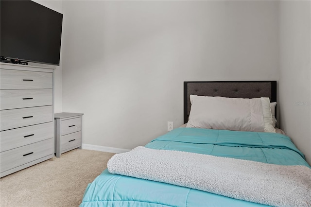 bedroom with carpet floors and baseboards