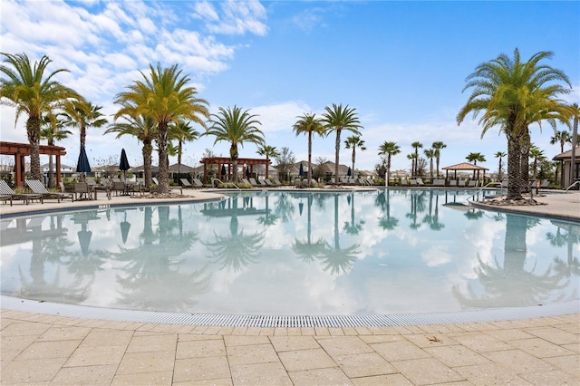 community pool featuring a patio and a gazebo