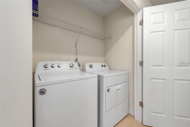 washroom with washing machine and dryer