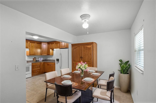 dining area featuring light tile patterned flooring