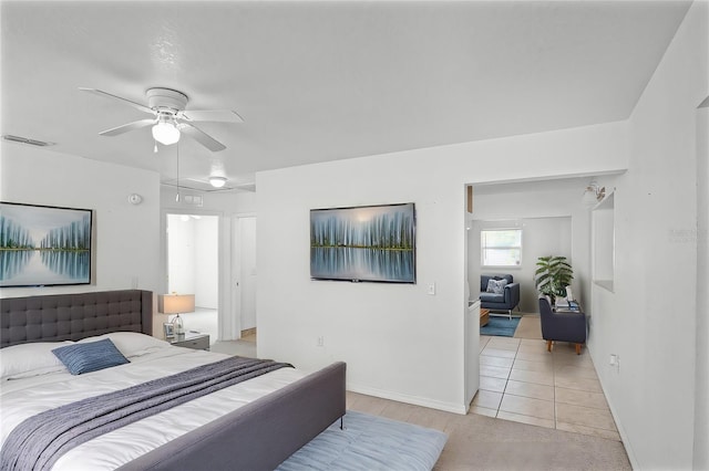 tiled bedroom with ceiling fan