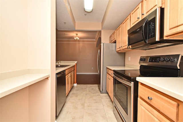 kitchen with light brown cabinetry, sink, a textured ceiling, light tile patterned floors, and appliances with stainless steel finishes