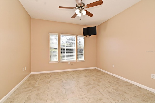 unfurnished room with light tile patterned floors and ceiling fan