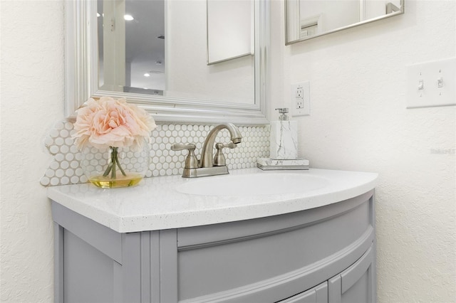 interior details featuring tasteful backsplash and vanity