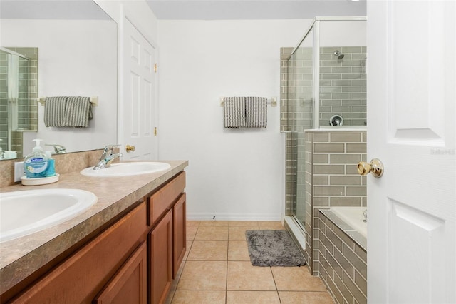 bathroom with tile patterned floors, separate shower and tub, and vanity