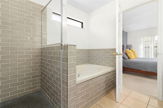 bathroom with tile patterned flooring and plus walk in shower