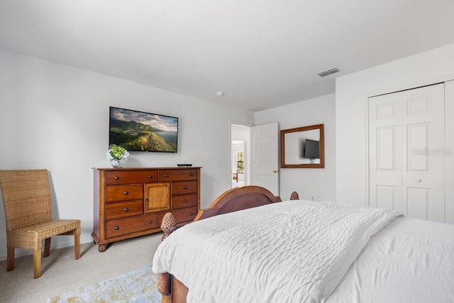 carpeted bedroom with a closet