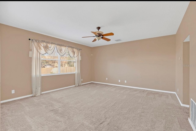 carpeted empty room with ceiling fan