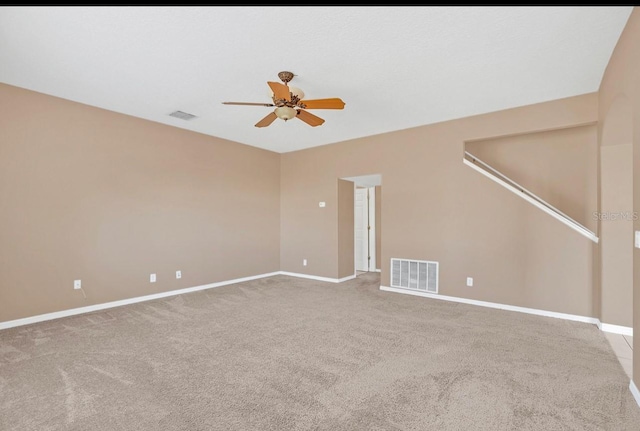 empty room with carpet and ceiling fan