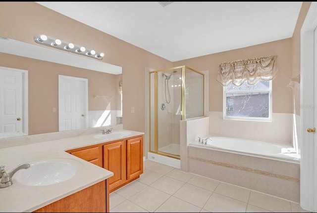 bathroom with vanity, plus walk in shower, and tile patterned flooring