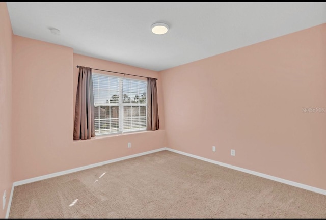 unfurnished room featuring carpet flooring