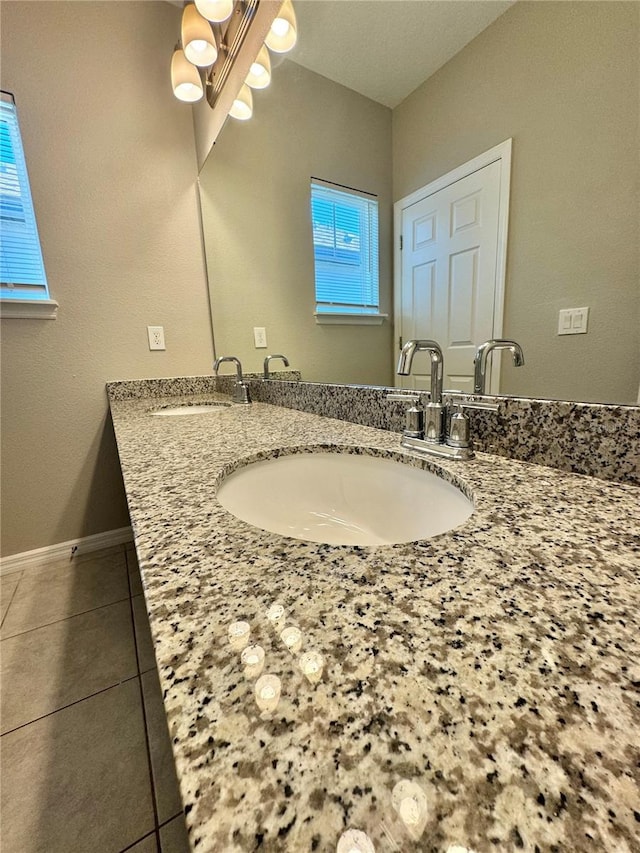 bathroom with tile patterned flooring and vanity