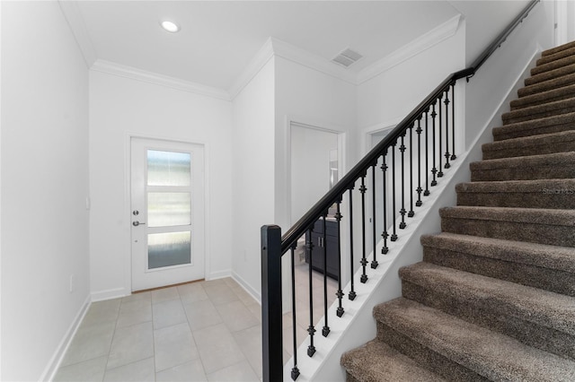 tiled foyer with crown molding