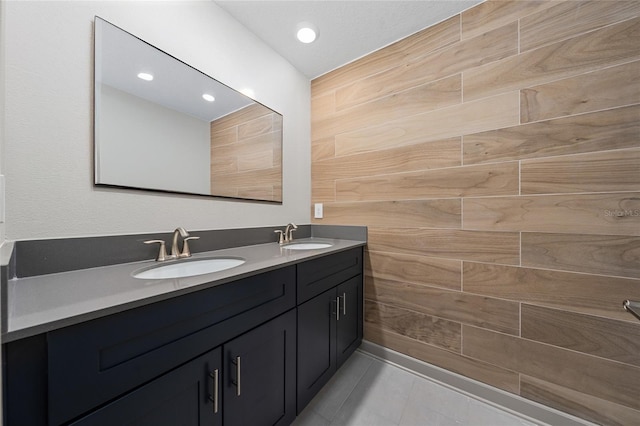 bathroom with tile patterned floors and vanity