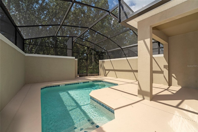 view of pool featuring a lanai and a patio