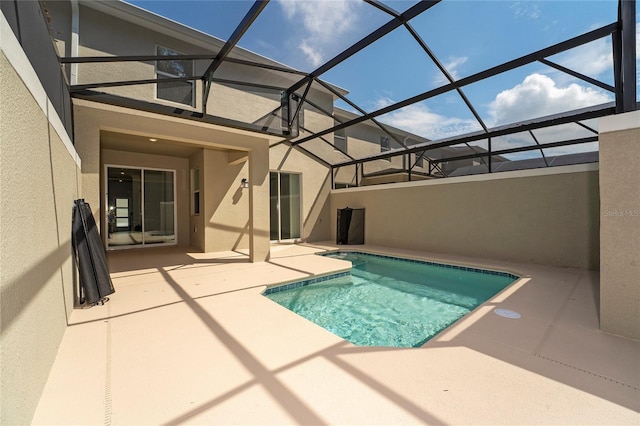 view of pool featuring a lanai and a patio