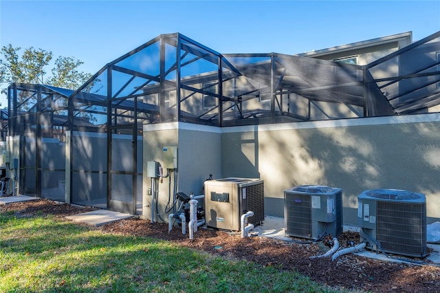 exterior space with a lanai and central air condition unit