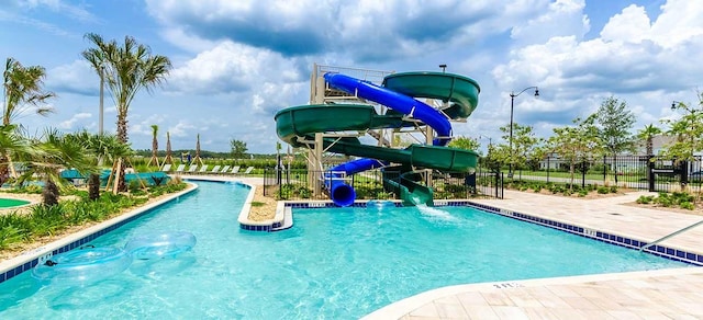 view of swimming pool featuring a water slide