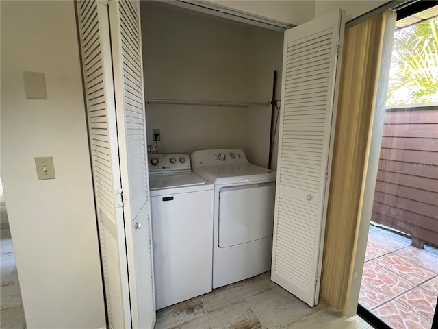 laundry room featuring washer and clothes dryer