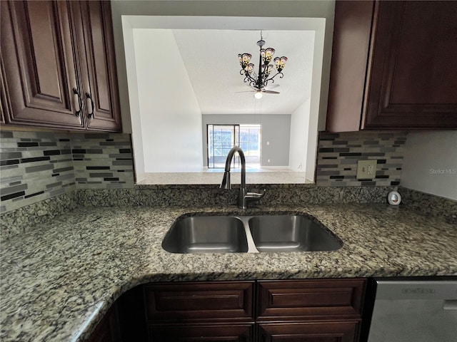 kitchen with stone countertops, tasteful backsplash, dishwasher, sink, and dark brown cabinetry