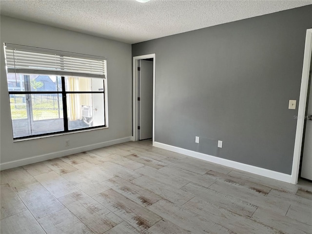 empty room featuring a textured ceiling