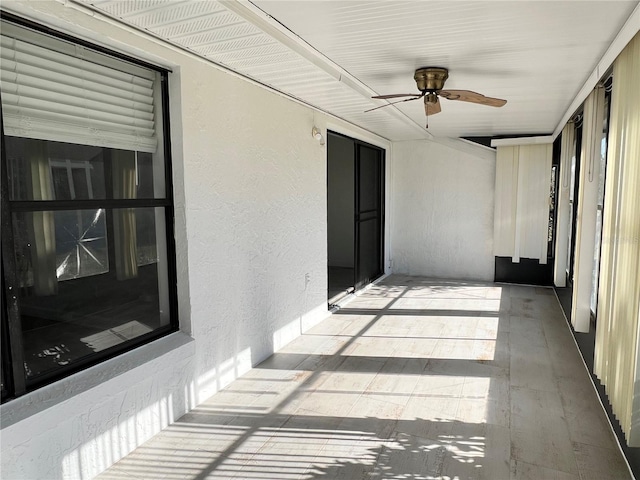 exterior space featuring ceiling fan