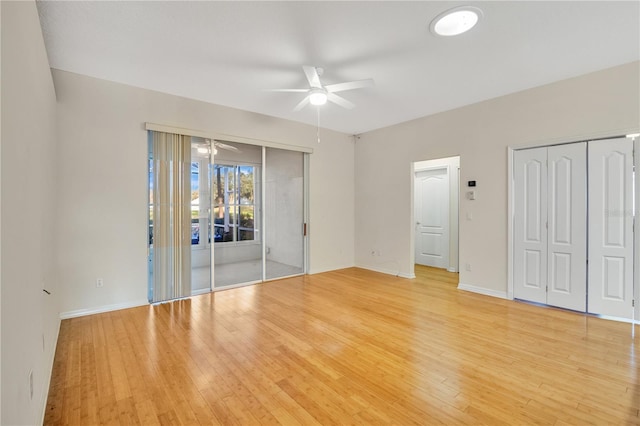 unfurnished room featuring ceiling fan and light hardwood / wood-style flooring