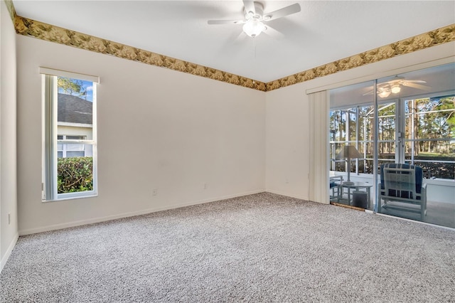 carpeted empty room with ceiling fan