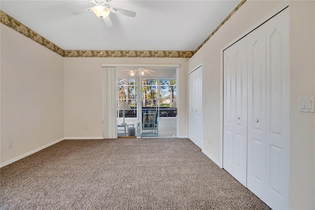 interior space featuring multiple closets, ceiling fan, and carpet flooring