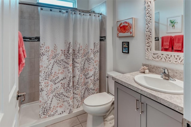 bathroom featuring vanity, a shower with curtain, tile patterned floors, and toilet