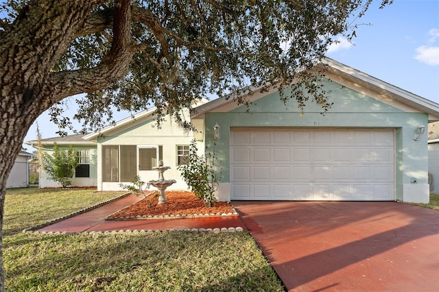 single story home with a garage and a front yard