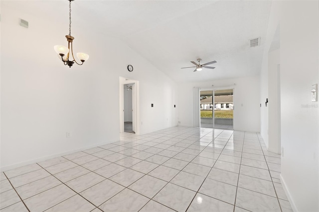 tiled empty room with ceiling fan with notable chandelier and high vaulted ceiling