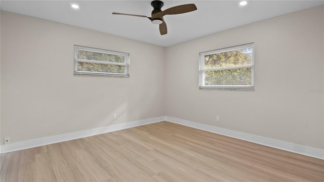 empty room featuring ceiling fan and light hardwood / wood-style floors