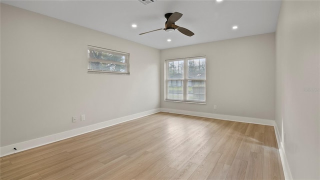 unfurnished room with ceiling fan and light hardwood / wood-style flooring