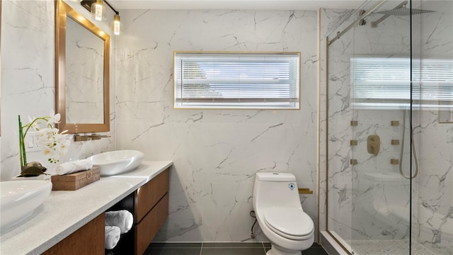 bathroom with walk in shower, vanity, and toilet