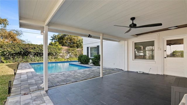 view of pool with ceiling fan and a patio area