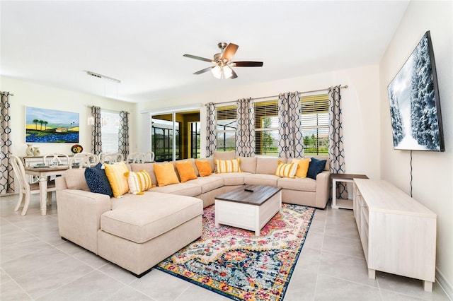 tiled living room featuring ceiling fan