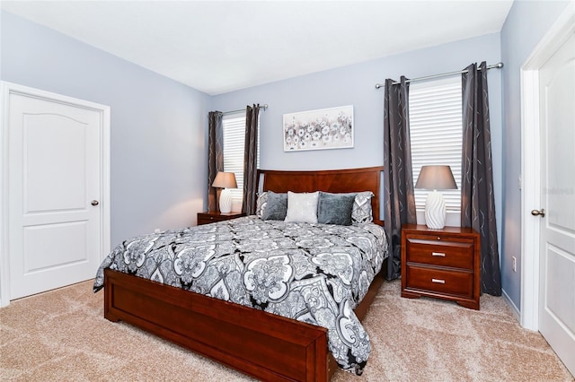 bedroom with light colored carpet