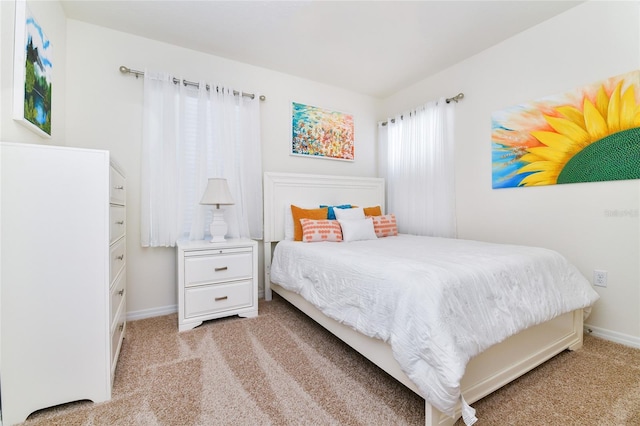 bedroom with light colored carpet