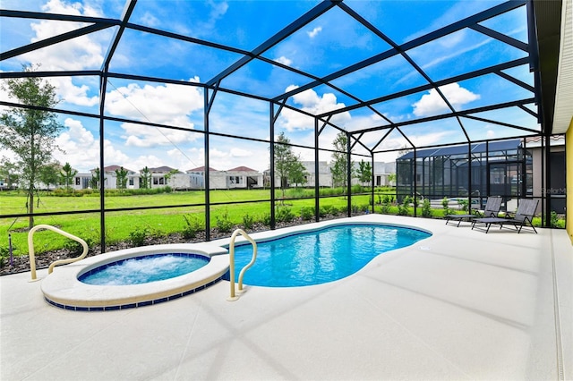 view of pool with an in ground hot tub, a lanai, a patio, and a lawn