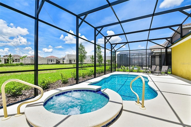 view of swimming pool featuring a patio area, a lawn, glass enclosure, and an in ground hot tub