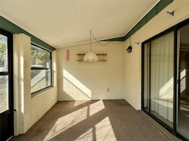 unfurnished sunroom featuring lofted ceiling