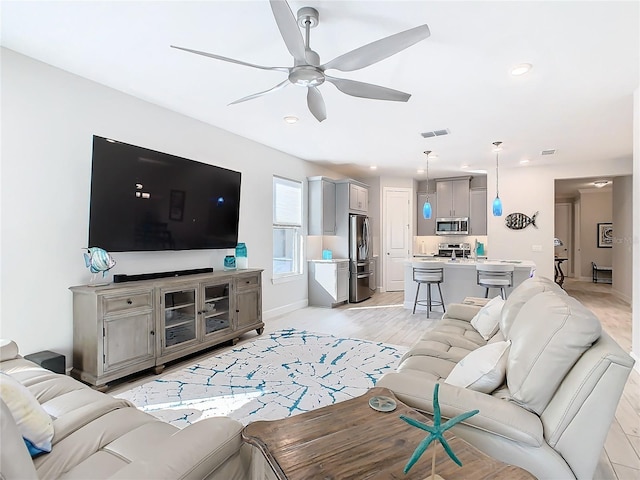 living room with ceiling fan