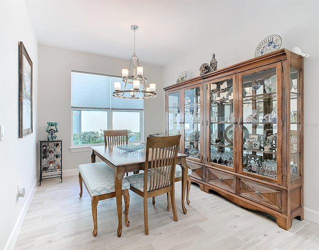 dining room featuring a chandelier and light hardwood / wood-style floors