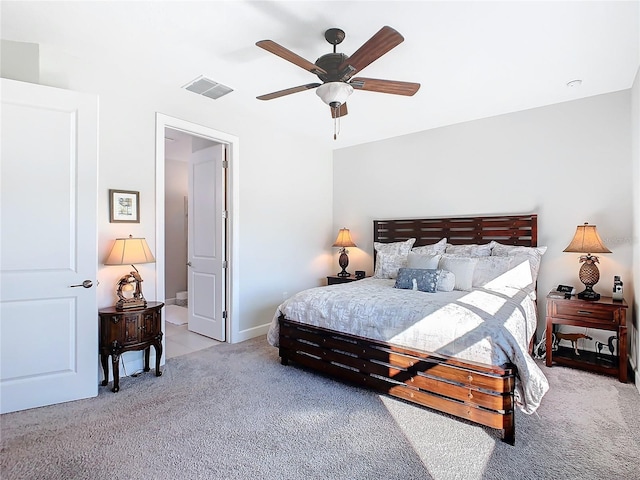 bedroom featuring ceiling fan and light carpet