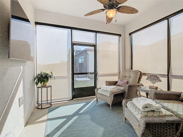 sunroom / solarium with ceiling fan