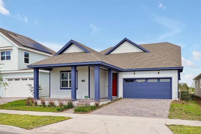 view of front of house featuring a garage and covered porch