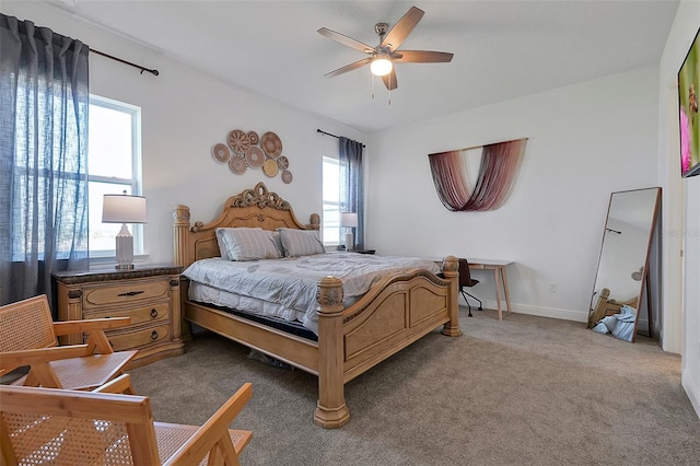 bedroom featuring ceiling fan and carpet